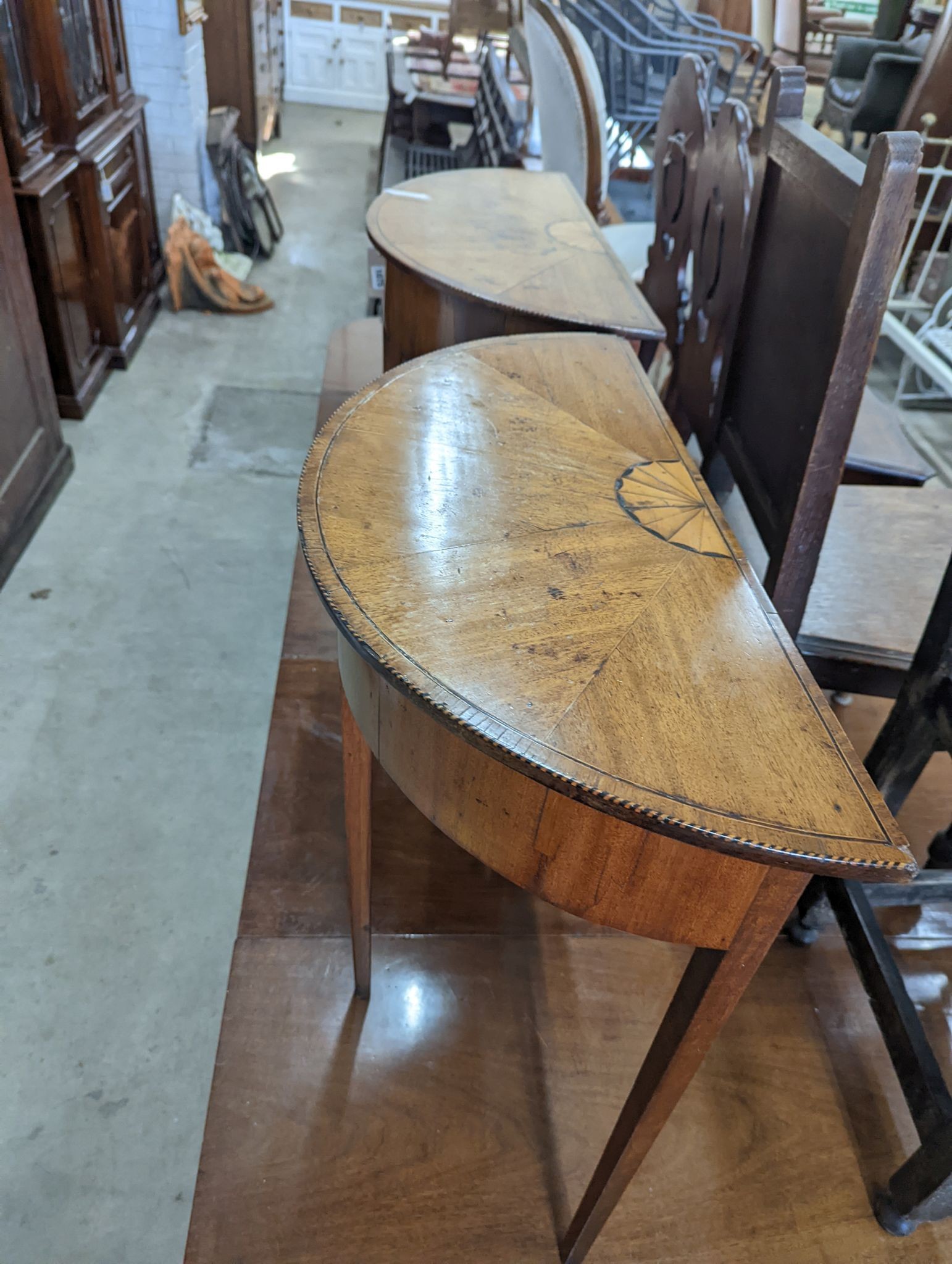 A pair of George III style inlaid mahogany D shaped side tables, width 64cm, depth 32cm, height 71cm